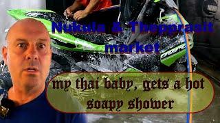 My thai baby gets a hot soapy shower, Nukula fish market, and shopping in Theppasit night market