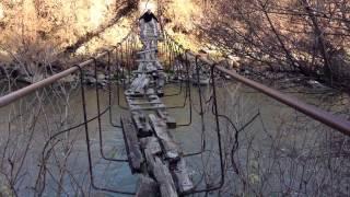 Rickety bridge in abandoned former soviet union area of old Armenia