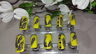 Yellow Black Forest Nail Design