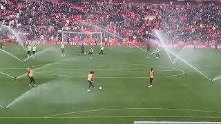 Liverpool subs warm up amongst the sprinklers at Anfield!