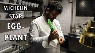 Chef Gal Ben Moshe prepares an eggplant canapé at his 1* restaurant Prism in Berlin