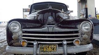 1947 Ford "Old Henry" drives through a blizzard north of Cortez, CO