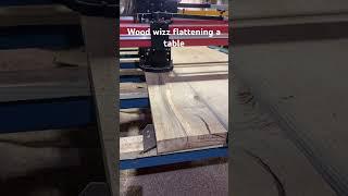 Flattening the top of a dining room table on a wood wiz