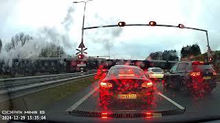 Dutch Dashcam: Steamlocomotive crossing the highway