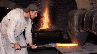 TRADITIONAL FORGING of iron with hammer. This is how it was modeled in an ARTISANAL IRONWORKS