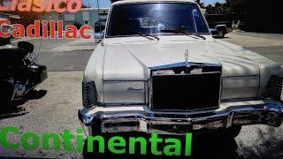 Clasico Cadillac Continental   ,,que modelo es comenta??