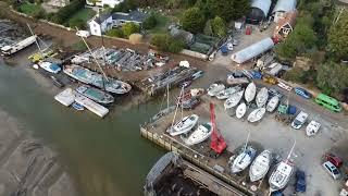 Boat yard , wrecks with tide out and boats stranded ..by drone  footage uk