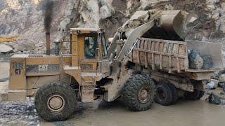 Caterpillar 966D Wheel Loader Loading Huge Stone On Mitsubishi Fuso Dumpers Trucks