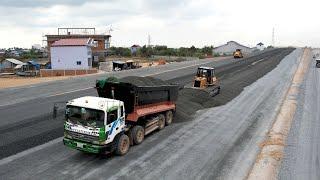 Powerful Komatsu D41P Bulldozer Spreading Gravel And Dump Trucks Unloading Gravel Building New Road