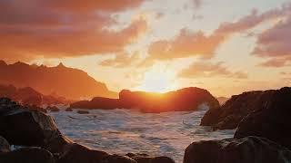 Sunset and ocean waves on a rocky shore, sea ambience for 10 hours