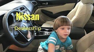 Nissan dealership Kids Adventures With Sweetie Fella Aleks checking out Nissan cars