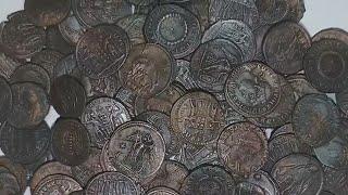 Tens of thousands of ancient coins have been found off Sardinia. They may be spoils of a shipwreck