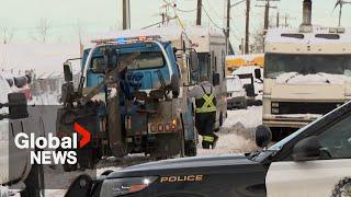 "They're forcing us out": Calgary police, tow trucks remove RVs from makeshift community