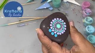 Dot mandala stone. Dot mandala painting on natural stone.