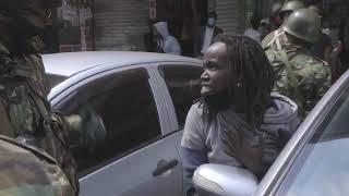 DRAMATIC SCENE As a Brave Woman protestor CONFRONTS Heavily armed Police officers