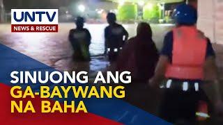 Pamilyang naipit sa ga-beywang na baha sa Bacoor, Cavite, nasaklolohan