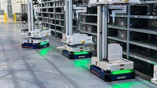 AI robots picking ecommerce orders in fully automated warehouse | Brightpick