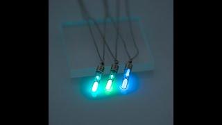 An hourglass necklace glows in the dark