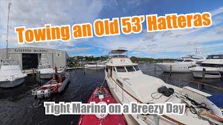 Towing an Old 53' Hatteras on a Hip Tow Into a Tight Slip On A Windy Day With a Safety Boat #towing