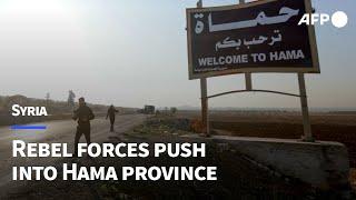 Syrian rebel forces advance past abandoned regime equipment in Hama | AFP