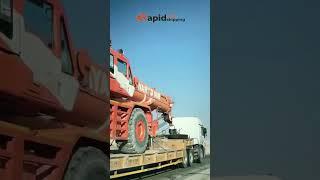 Lowboy Trailer in Action: Watch Heavy Crane Shipping Magic! 