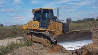 John Deere 750J stripping topsoil part 1