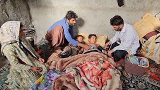 Reza being treated by a doctor in the mountains