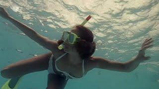 Couple Snorkeling Together