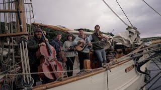 Jon Boden, Seth Lakeman, Ben Nicholls, Emily Portman and Jack Rutter on a tall ship