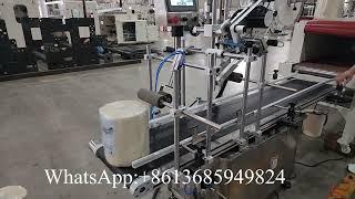 Automatic maxi roll paper handle application machine