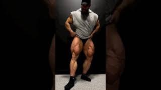 Bearded muscle giant showing of big massive muscle thighs