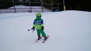 7 year old skier takes awesome run on snow-cross. Catches mad air!