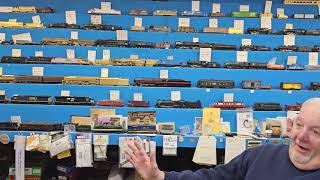 The Wall of Brass Trains at Tommy Gilberts Hobby shop.