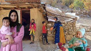 Sepideh and Parisa and some of their children building a wall in a forest hut