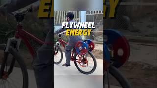 A smart guy who uses a flywheel system on his bike.
