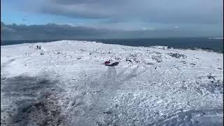 Paul snowbody boarding on St.Agnes Beacon 1. 17.01.2023