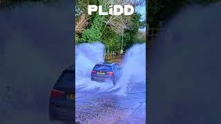 BMW SUV Splashing through Rufford Ford river 