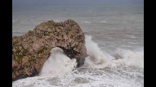 Durdle Door hit by stunning waves during Storm Ciarán