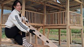 Building a wooden house, completing the corridor of a 2-storey wooden stilt house of a rural girl