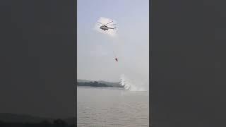 Mi-17 helicopter displaying fire fighting operations using a bambi bucket