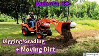 Kubota BX- Moving dirt, Filling low spots, Grading + Digging a stump