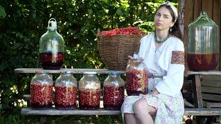 A lot of work in village! Ukrainian woman is  making traditional cherry drink "vyshnyak" 