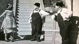 Laurel and Hardy - Laurel kicking a lady arse