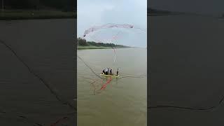 Throwing a Large Fishing Net into the River