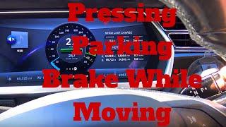 Tesla Motors: Pressing Parking Brake While Moving