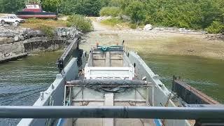 Landing Craft "Inlet Raider" entering Hummingbird Cove at low tide.