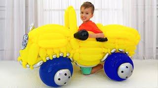 Vlad and Nikita pretend play with toy car from balloons