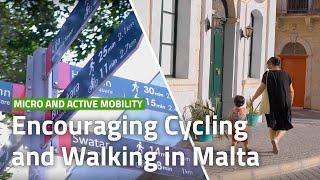 How can active travel totems promote walking and cycling in Malta?