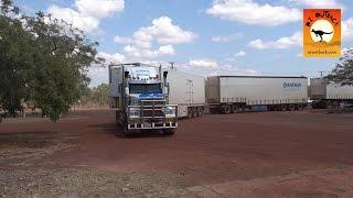 Massive road trains at roadhouses in outback Australia