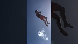 This man is flying with a Kite! 